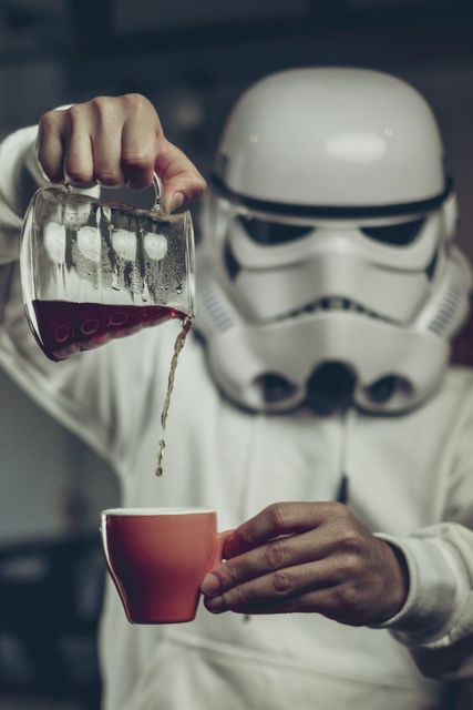 A Star Wars storm trooper pouring coffee at Origen Tostadores de Café