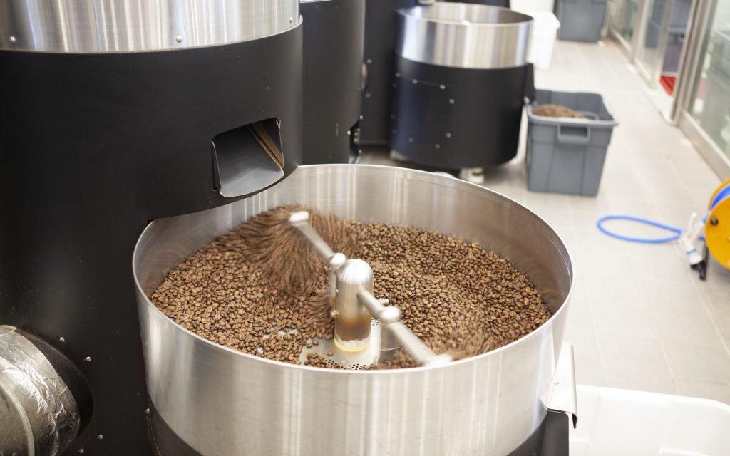 Roasted coffee beans cool down in the Stronghold S9X electric machine's cooling tray