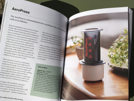 Inside the book. This section is on the AeroPress and has a lengthy explanation of how to use it. On the right side is a photo of an AeroPress sitting on top of a ceramic cup. 