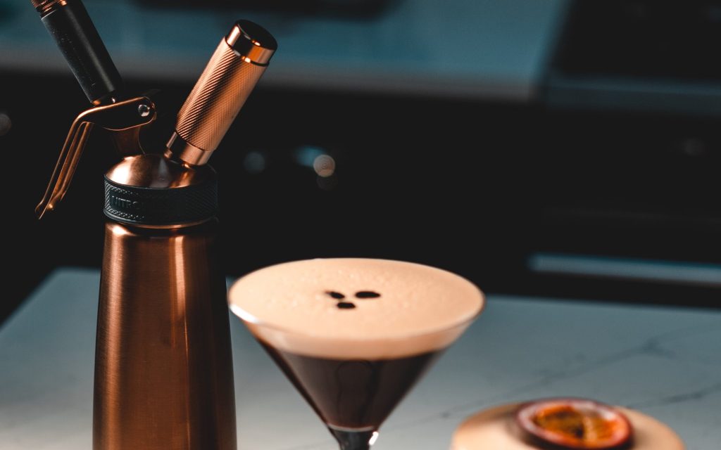 An espresso martini alongside other coffee cocktails.