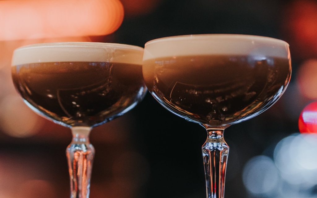 Two coffee cocktails in cocktail glasses.