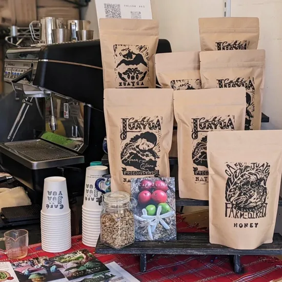 Bags of Café Juayúa coffee on display. Linda Gonzalez designs the bags herself with woodblock print designs.