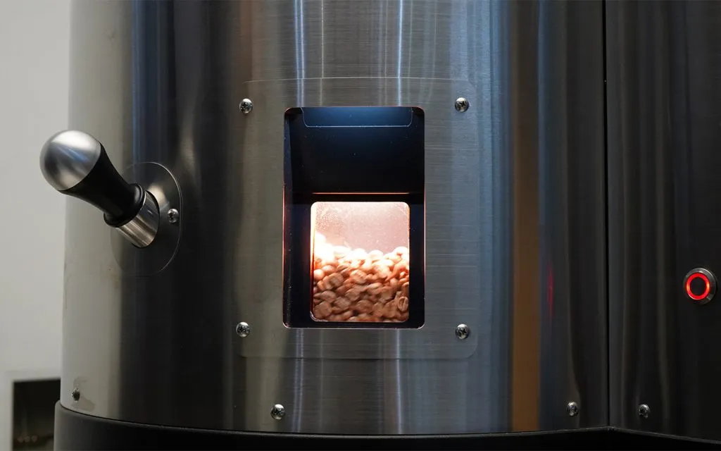 Green beans being roasted in the Stronghold S9X electric roaster